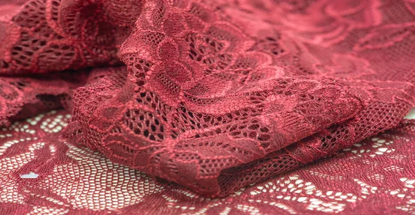 red lace. Elastic fashionable textile jacquard lace. Decorative item for sexy lingerie. elastic tapes. Home decor. Texture for your design. background. template.