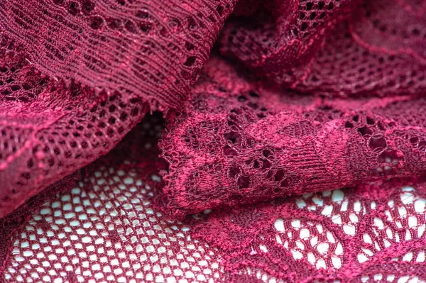 red lace. Elastic fashionable textile jacquard lace. Decorative item for sexy lingerie. elastic tapes. Home decor. Texture for your design. background. template.