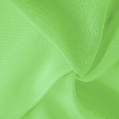 Doku. şablon. Açık yeşil ipek polyester. Kireç yeşili ipek kumaştan. Şeffaf arkaplan ve elbise dikmek için açık kumaştan yapılmış. Tekstil panoraması