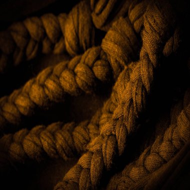 Doku, arka plan, desen. Sarı örgülü kumaş. Kabartmalı desenli örgü bir arka plan. Örgü ören örgüler..