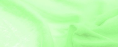 Yeşil kumaş. Lüks kumaşın soyut arka planı ya da dalgaların sıvı ipek dokusu ya da dalgalı kıvrımlar. arka plan ya da zarif duvar kağıdı tasarımı. Pamuk dokusu, doğal kumaş ve boya, parlak yeşil renk.