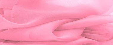 Doku. şablon. İpek kırmızı polyester. Pembe ipek kumaşın arka planı. Şeffaf arkaplan ve elbise dikmek için açık kumaştan yapılmış. Tekstil panoraması