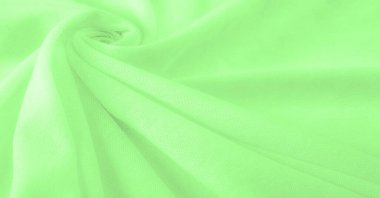Yeşil kumaş. Lüks kumaşın soyut arka planı ya da dalgaların sıvı ipek dokusu ya da dalgalı kıvrımlar. arka plan ya da zarif duvar kağıdı tasarımı. Pamuk dokusu, doğal kumaş ve boya, parlak yeşil renk.