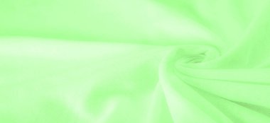 Yeşil kumaş. Lüks kumaşın soyut arka planı ya da dalgaların sıvı ipek dokusu ya da dalgalı kıvrımlar. arka plan ya da zarif duvar kağıdı tasarımı. Pamuk dokusu, doğal kumaş ve boya, parlak yeşil renk.