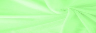 Yeşil kumaş. Lüks kumaşın soyut arka planı ya da dalgaların sıvı ipek dokusu ya da dalgalı kıvrımlar. arka plan ya da zarif duvar kağıdı tasarımı. Pamuk dokusu, doğal kumaş ve boya, parlak yeşil renk.