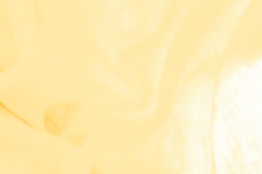 Sarı kumaş. Lüks kumaşın soyut arka planı ya da dalgaların sıvı ipek dokusu ya da dalgalı kıvrımlar. arka plan ya da zarif duvar kağıdı tasarımı. Pamuk dokusu, doğal kumaş ve boya, parlak sarı renk.