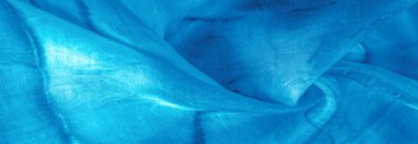 Turkuaz arka planda gri lekeli mavi kumaş. Soyut tasarımcı kumaş tasarımcısı. Tasarımın için güzel bir arka plan. Doku. Görüntü. çizim, kalıp, şekil