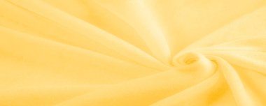 Sarı kumaş. Lüks kumaşın soyut arka planı ya da dalgaların sıvı ipek dokusu ya da dalgalı kıvrımlar. arka plan ya da zarif duvar kağıdı tasarımı. Pamuk dokusu, doğal kumaş ve boya, parlak sarı renk.