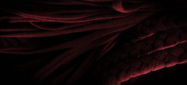 Doku, arka plan, desen. Kırmızı örgülü kumaş. Kabartmalı desenli örgü bir arka plan. Örgü ören örgüler..