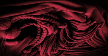 Doku, arka plan, desen. Kırmızı örgülü kumaş. Kabartmalı desenli örgü bir arka plan. Örgü ören örgüler..