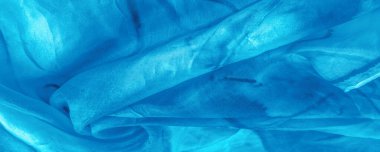 Turkuaz arka planda gri lekeli mavi kumaş. Soyut tasarımcı kumaş tasarımcısı. Tasarımın için güzel bir arka plan. Doku. Görüntü. çizim, kalıp, şekil