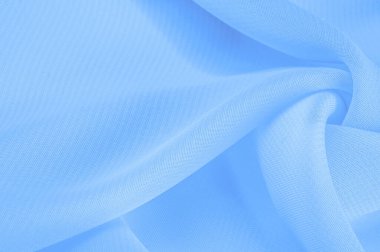 Doku. şablon. Açık mavi ipek polyester. Su rengi ipek kumaşın arka planı. Şeffaf arkaplan ve elbise dikmek için açık kumaştan yapılmış. Tekstil panoraması