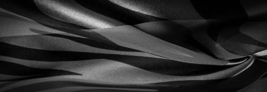 Doku. Geçmişi. Şablon. Soyut siyah ve beyaz renklerde ipek kumaş. Soyut suluboya, desenli dikey ipek kumaş, tuval, makro, yakın çekim.