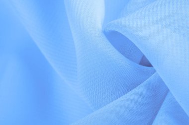 Doku. şablon. Açık mavi ipek polyester. Su rengi ipek kumaşın arka planı. Şeffaf arkaplan ve elbise dikmek için açık kumaştan yapılmış. Tekstil panoraması