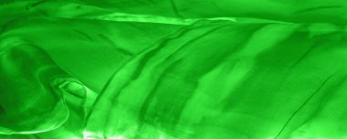 Yeşil arka planda gri lekeli yeşil kumaş. Soyut tasarımcı kumaş tasarımcısı. Tasarımın için güzel bir arka plan. Doku. Görüntü. çizim, kalıp, şekil