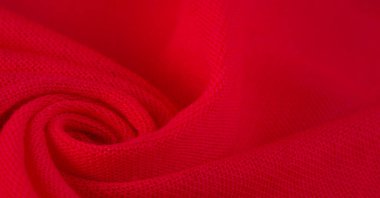 Kırmızı bez. Lüks kumaşın soyut arka planı ya da dalgaların sıvı ipek dokusu ya da dalgalı kıvrımlar. arka plan ya da zarif duvar kağıdı tasarımı. Pamuk dokusu, doğal kumaş ve boya, parlak kırmızı renk..