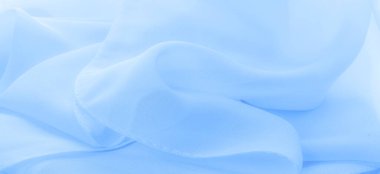 Doku. şablon. Açık mavi ipek polyester. Su rengi ipek kumaşın arka planı. Şeffaf arkaplan ve elbise dikmek için açık kumaştan yapılmış. Tekstil panoraması