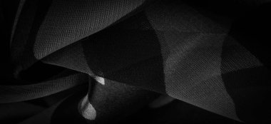 Doku. Geçmişi. Şablon. Soyut siyah ve beyaz renklerde ipek kumaş. Soyut suluboya, desenli dikey ipek kumaş, tuval, makro, yakın çekim.