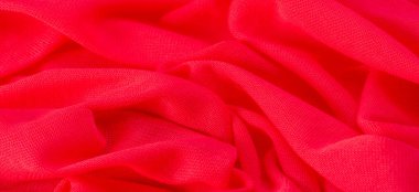 Kırmızı bez. Lüks kumaşın soyut arka planı ya da dalgaların sıvı ipek dokusu ya da dalgalı kıvrımlar. arka plan ya da zarif duvar kağıdı tasarımı. Pamuk dokusu, doğal kumaş ve boya, parlak kırmızı renk..