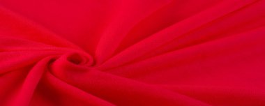 Kırmızı bez. Lüks kumaşın soyut arka planı ya da dalgaların sıvı ipek dokusu ya da dalgalı kıvrımlar. arka plan ya da zarif duvar kağıdı tasarımı. Pamuk dokusu, doğal kumaş ve boya, parlak kırmızı renk..