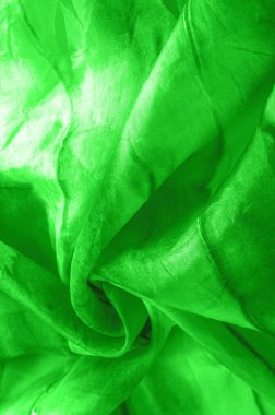 Yeşil arka planda gri lekeli yeşil kumaş. Soyut tasarımcı kumaş tasarımcısı. Tasarımın için güzel bir arka plan. Doku. Görüntü. çizim, kalıp, şekil