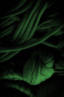 Doku, arka plan, desen. Yeşil örgülü kumaş. Kabartmalı desenli örgü bir arka plan. Örgü ören örgüler..