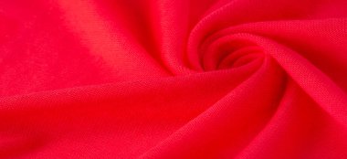 Kırmızı bez. Lüks kumaşın soyut arka planı ya da dalgaların sıvı ipek dokusu ya da dalgalı kıvrımlar. arka plan ya da zarif duvar kağıdı tasarımı. Pamuk dokusu, doğal kumaş ve boya, parlak kırmızı renk..