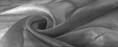 Beyaz arka planda gri benekli siyah beyaz kumaş. Soyut tasarımcı kumaş tasarımcısı. Tasarımın için güzel bir arka plan. Doku. Görüntü. çizim, kalıp, şekil