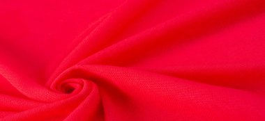 Kırmızı bez. Lüks kumaşın soyut arka planı ya da dalgaların sıvı ipek dokusu ya da dalgalı kıvrımlar. arka plan ya da zarif duvar kağıdı tasarımı. Pamuk dokusu, doğal kumaş ve boya, parlak kırmızı renk..