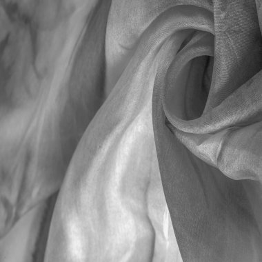 Beyaz arka planda gri benekli siyah beyaz kumaş. Soyut tasarımcı kumaş tasarımcısı. Tasarımın için güzel bir arka plan. Doku. Görüntü. çizim, kalıp, şekil