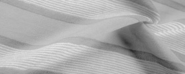 Doku. Geçmişi. Tek renkli gri ipek kumaş, bir fotoğraf ya da resim siyah beyaz ya da tek renk farklı tonlarda geliştirilmiş ya da uygulanmış..