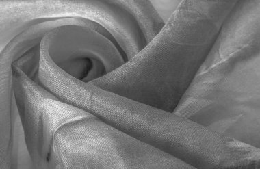 Beyaz arka planda gri benekli siyah beyaz kumaş. Soyut tasarımcı kumaş tasarımcısı. Tasarımın için güzel bir arka plan. Doku. Görüntü. çizim, kalıp, şekil