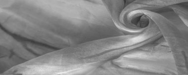 Beyaz arka planda gri benekli siyah beyaz kumaş. Soyut tasarımcı kumaş tasarımcısı. Tasarımın için güzel bir arka plan. Doku. Görüntü. çizim, kalıp, şekil