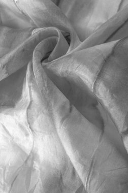 Beyaz arka planda gri benekli siyah beyaz kumaş. Soyut tasarımcı kumaş tasarımcısı. Tasarımın için güzel bir arka plan. Doku. Görüntü. çizim, kalıp, şekil