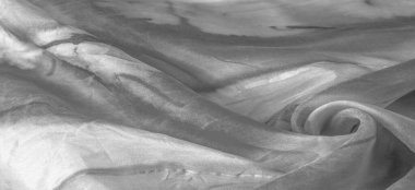 Beyaz arka planda gri benekli siyah beyaz kumaş. Soyut tasarımcı kumaş tasarımcısı. Tasarımın için güzel bir arka plan. Doku. Görüntü. çizim, kalıp, şekil