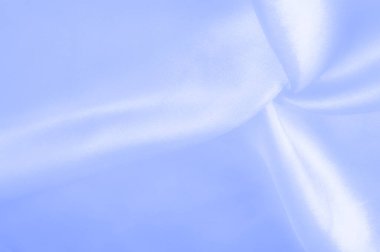 Mavi ipek kumaş, pürüzsüz mavi ipek ya da lüks saten kumaş, düğün arka planı olarak doku. Lüks arka plan tasarımı. Retro biçimi.