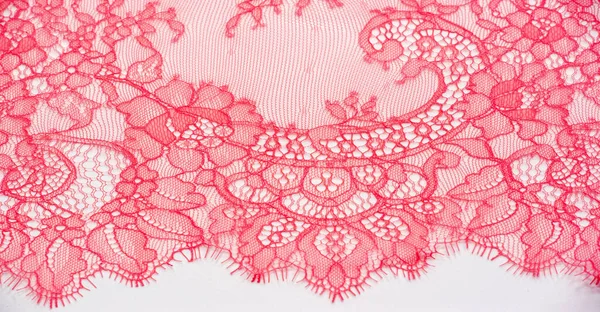 lace fabric. bird feather. red on a white background. Delicately crafted from yarn or thread, lace fabrics have historically embodied class and beauty since their inception in the 16th century.