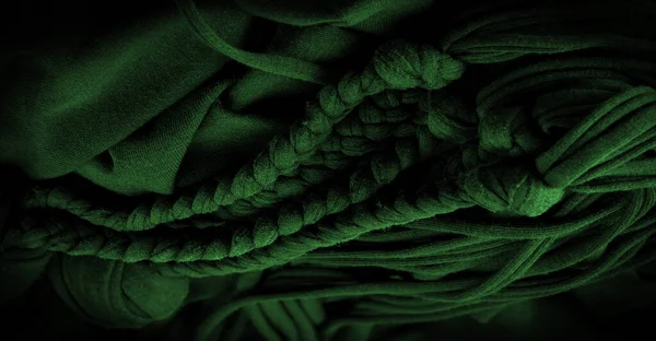 テクスチャ パターン 緑の組紐の生地 エンボスパターンでニットニットの背景 編み物で編組 — ストック写真