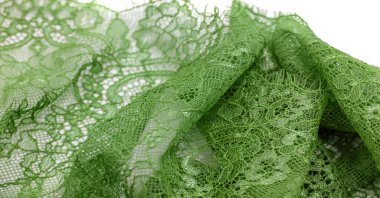 Beyaz arka planda yeşil dantel kumaş. Süslü Afrika polyester ve tüllü dantel kumaş. Tasarımın için çiçekler. Doku. Geçmişi. Şablon