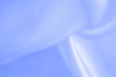 Mavi ipek kumaş, pürüzsüz mavi ipek ya da lüks saten kumaş, düğün arka planı olarak doku. Lüks arka plan tasarımı. Retro biçimi.