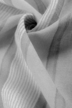 Doku. Geçmişi. Tek renkli gri ipek kumaş, bir fotoğraf ya da resim siyah beyaz ya da tek renk farklı tonlarda geliştirilmiş ya da uygulanmış..