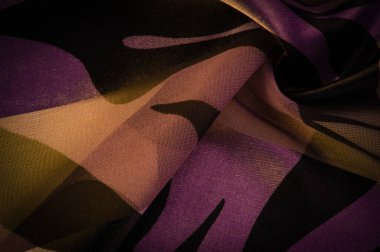 Doku. Geçmişi. Şablon. Soyut kahverengi ve mavi-sarı tonlarda ipek kumaş. Soyut suluboya boya, desenli dikey ipek kumaş, tuval, makro, yakın plan, pastel.