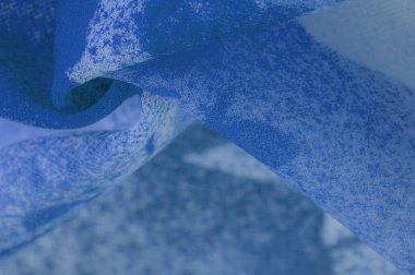 Doku. Geçmişi. şablon. Soyut mavi ipek şifon kumaş. Kot ipeği tafta renginde sanatsal düzen.