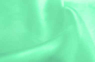 Yeşil soluk ipek kumaş, pürüzsüz kırmızı ipek ya da lüks saten kumaş, düğün arka planı olarak doku. Lüks arka plan tasarımı. Retro biçimi.