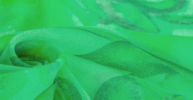 Doku, Desen. Soyut yeşil desenli pürüzsüz yeşil kumaş dokusu. Lüks soyut bir arka plan. Lüks Noel geçmişi. Kumaş, narin.