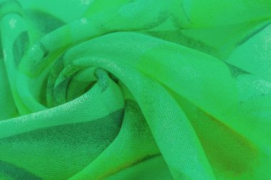 Doku, Desen. Soyut yeşil desenli pürüzsüz yeşil kumaş dokusu. Lüks soyut bir arka plan. Lüks Noel geçmişi. Kumaş, narin.