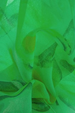 Doku, Desen. Soyut yeşil desenli pürüzsüz yeşil kumaş dokusu. Lüks soyut bir arka plan. Lüks Noel geçmişi. Kumaş, narin.