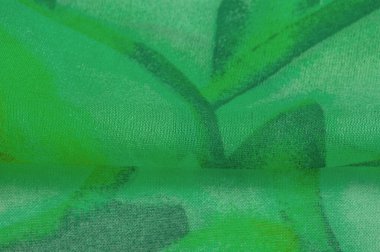 Doku, Desen. Soyut yeşil desenli pürüzsüz yeşil kumaş dokusu. Lüks soyut bir arka plan. Lüks Noel geçmişi. Kumaş, narin.