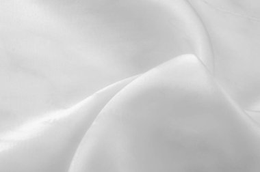 Beyaz ipek kumaş, pürüzsüz beyaz ipek ya da lüks saten kumaş, düğün arka planı olarak doku. Lüks arka plan tasarımı. Retro biçimi.