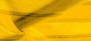 Doku. Geçmişi. Sarı renkli ipek kumaş, spektrumdaki yeşil ve turuncu arasındaki renk, maviye tamamlayıcı nitelikte birincil bir renk; olgun limon ya da yumurta sarısı gibi renklendirilmiş.